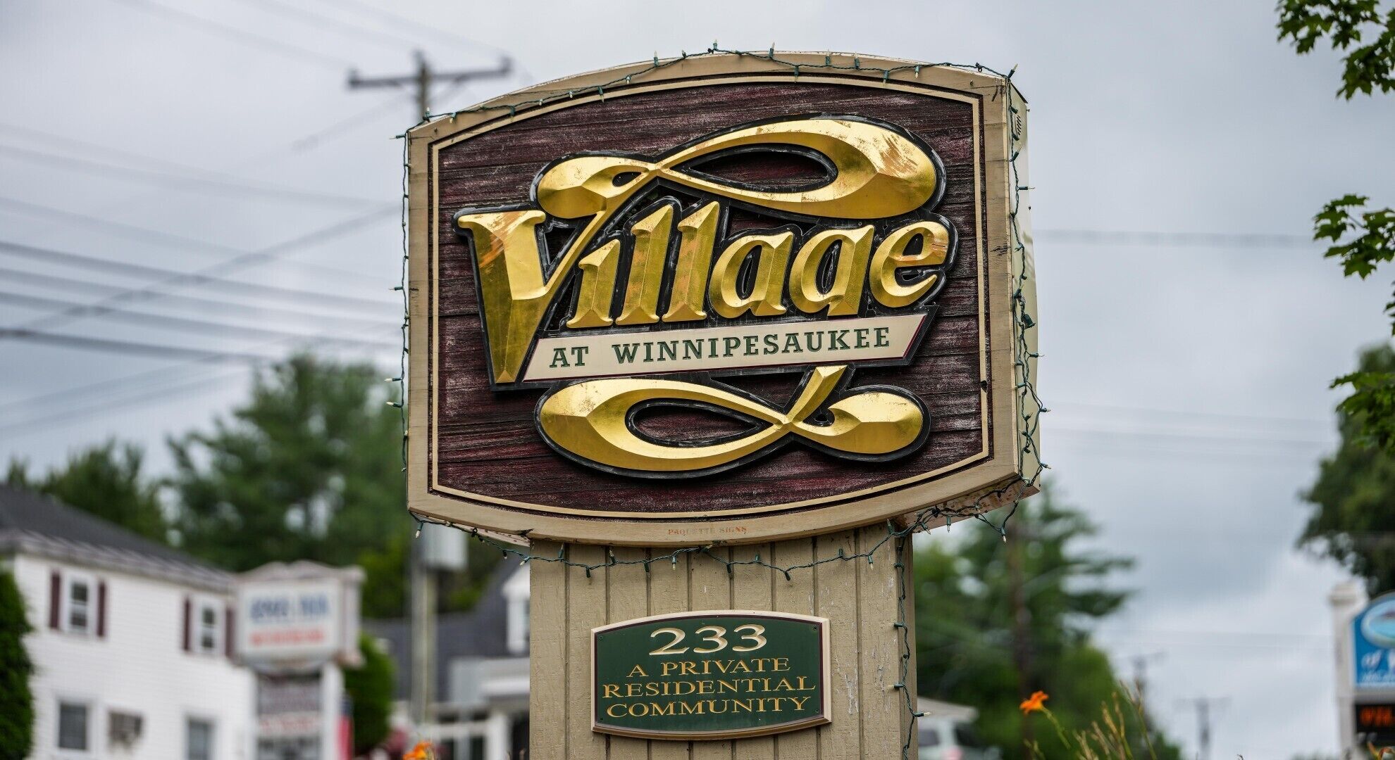 A sign for a private residential community named Village at Winnipeg.