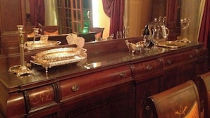 A wooden dresser with drawers and a mirror. - pyramids kingdom apartment (الجيزة)