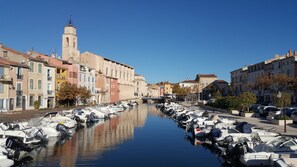 A canal lined with boats and historic buildings.