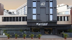 A modern hotel building with a prominent logo and signage. - Kyriad Hotel Pimpri (Pune)