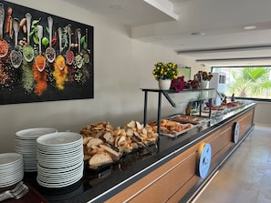 Indulge in a sumptuous spread of fresh bread, pastries, and seasonal fruits at our buffet.