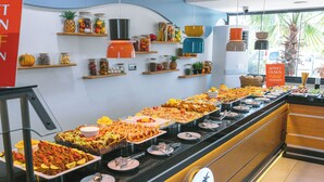 A buffet with various food items and condiments. - Palmila Butik Otel (Silifke)