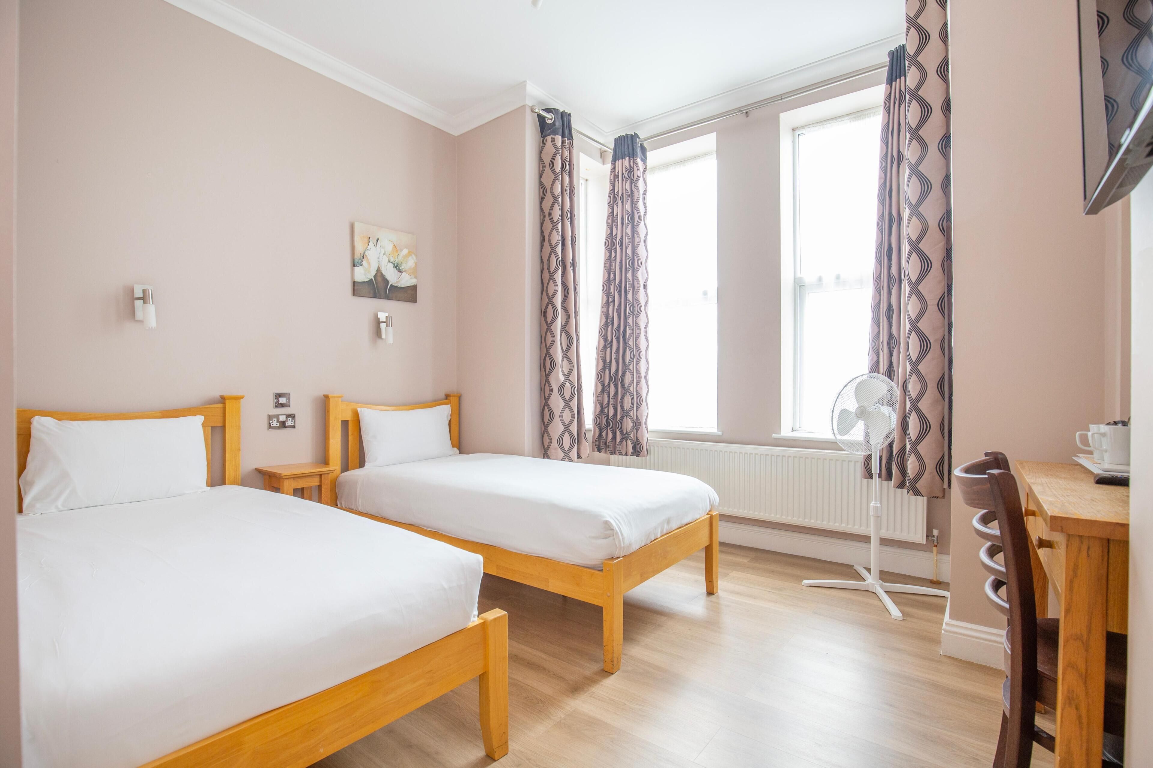 Standard Twin Room | Desk, blackout drapes, iron/ironing board, free WiFi
