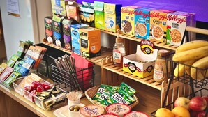 A breakfast bar with various food items and beverages. - Marlborough Hotel (Norwich)