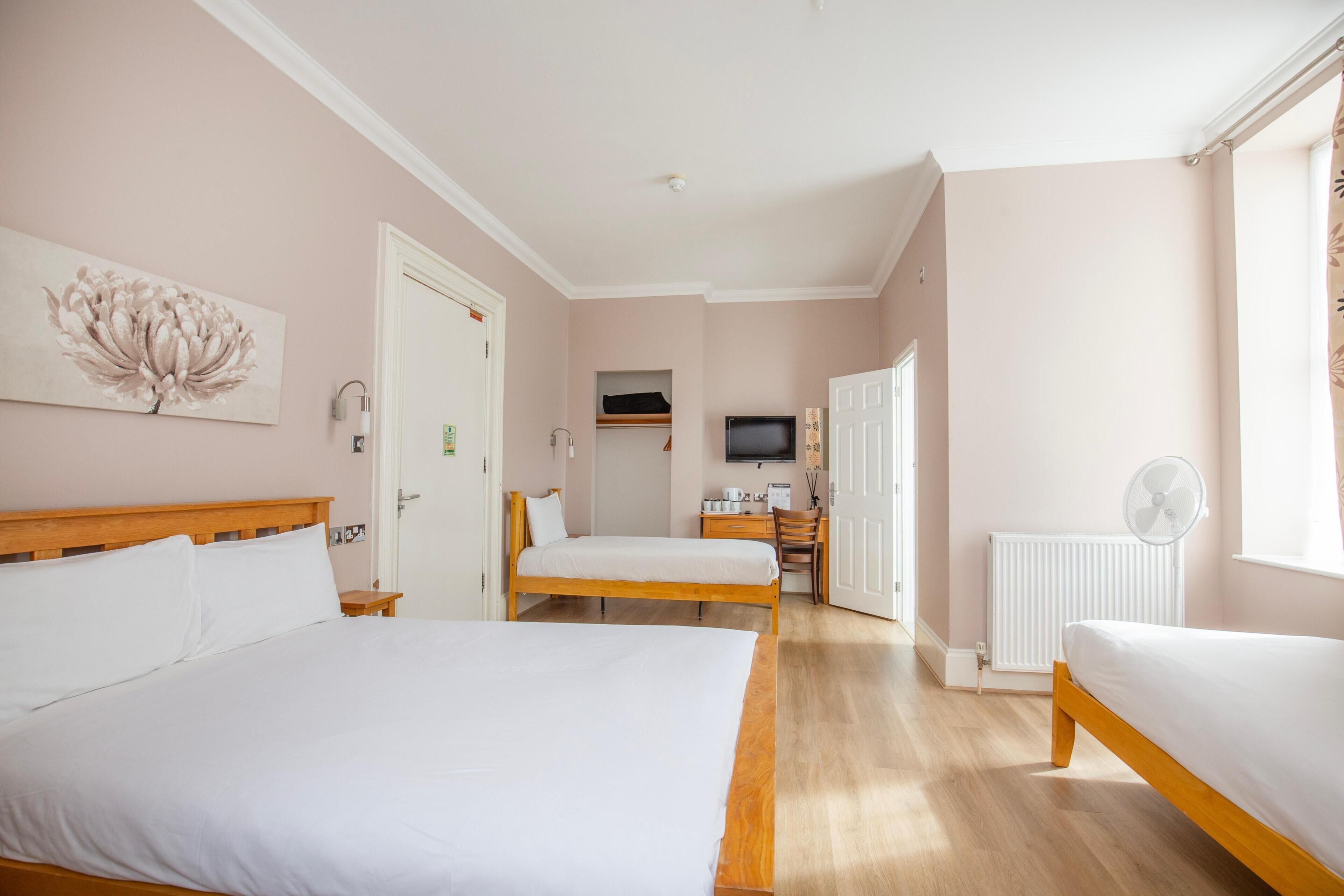 Family Quadruple Room | Desk, blackout drapes, iron/ironing board, free WiFi