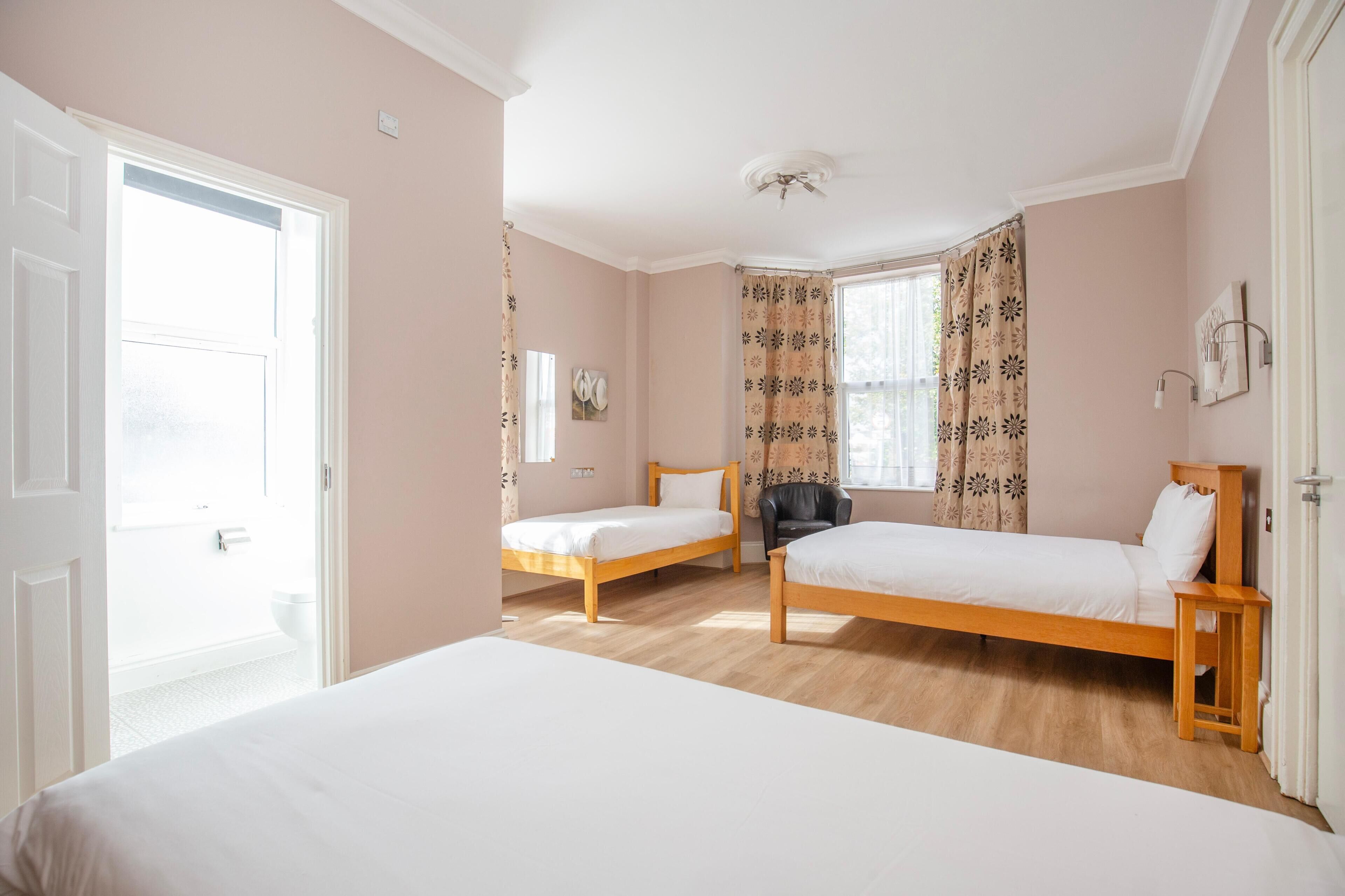 Family Quadruple Room | Desk, blackout drapes, iron/ironing board, free WiFi