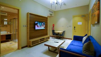 Superior Double Room | Living area | 24-inch LED TV with satellite channels, TV