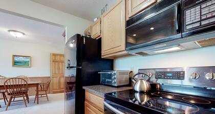 Mountain-view condo with deck, wood stove, & W/D - close to ski/hike/shopping