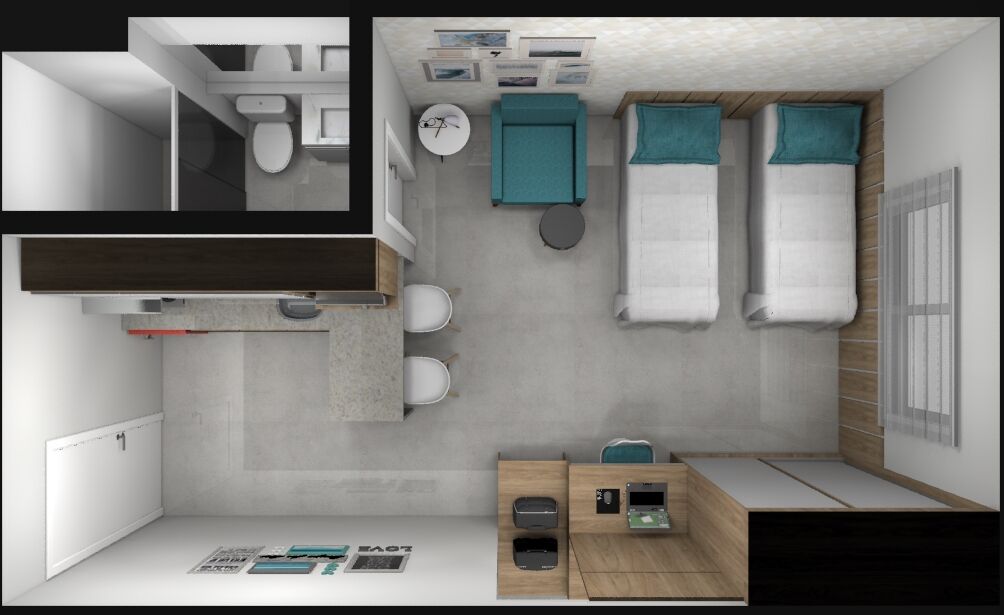 A compact hotel room with a bathroom, a small sitting area, a bed, and a kitchenette.