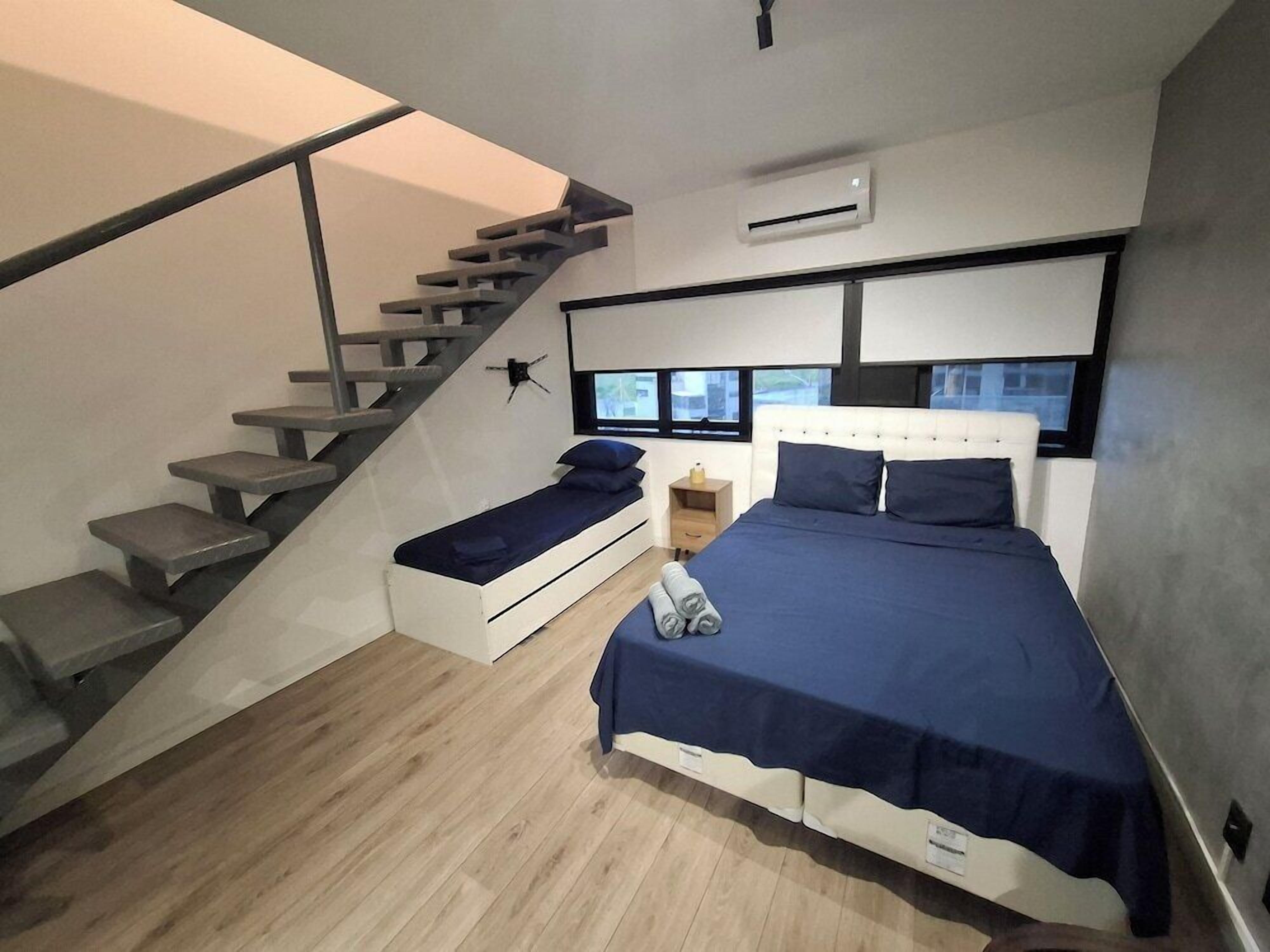 Premium bedding, desk, laptop workspace, free WiFi