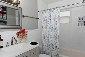Combined shower/tub, hair dryer, towels, soap