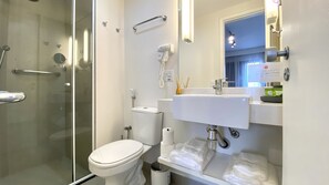 Premium Studio | Bathroom | Shower, hair dryer, soap, shampoo