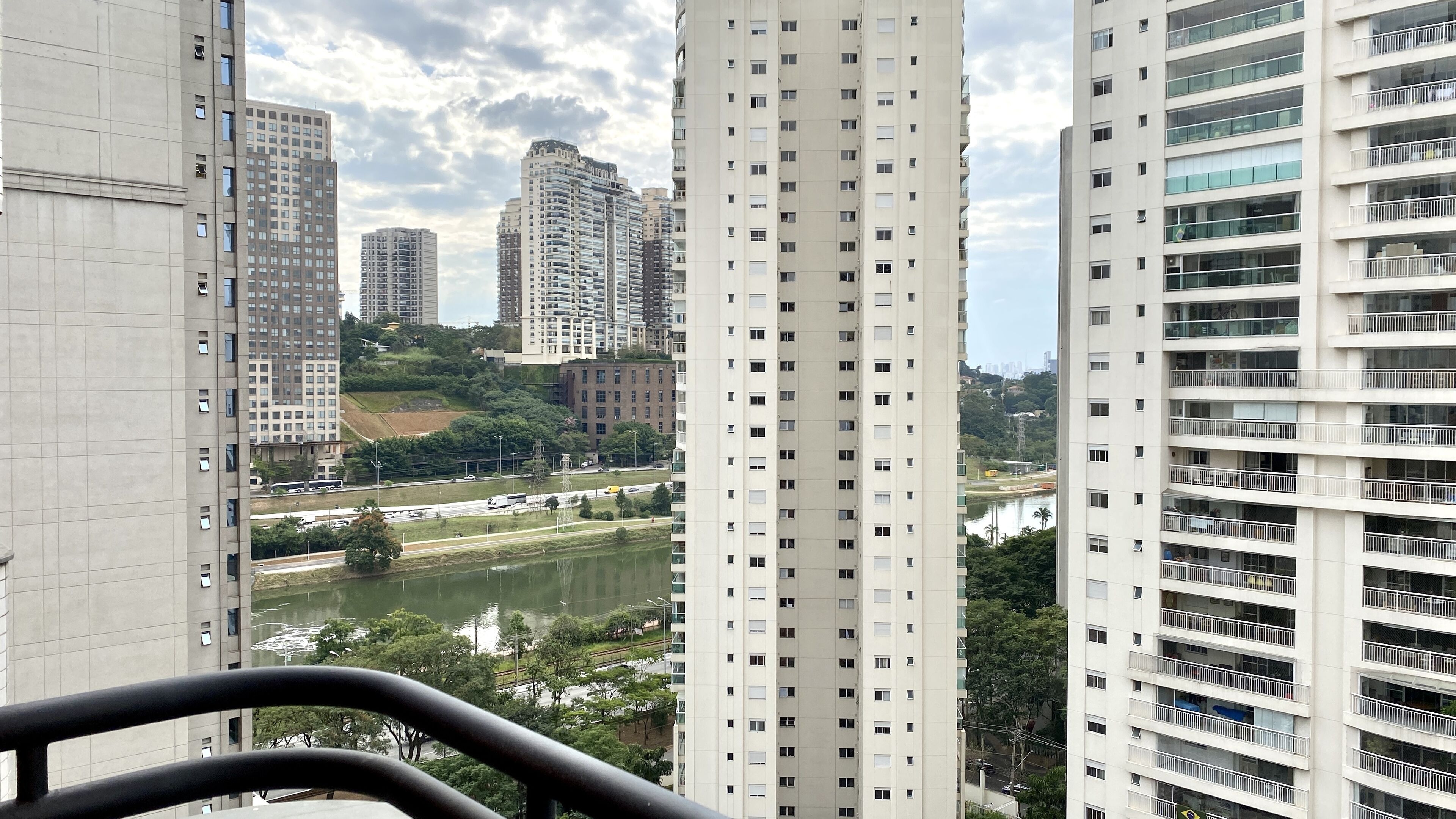 A high-rise building with multiple floors, large windows, and balconies.