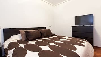 1 bedroom, desk, iron/ironing board, travel crib