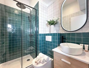 Shower, hair dryer, towels, soap