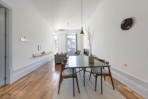 Enjoy meals in this spacious dining area with a large table and comfortable seating for six.