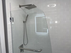Bathtub, hair dryer, towels, soap