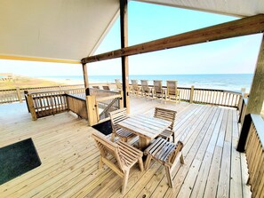 Outdoor dining - Beachfront Retreat | Gulf Views, Wraparound Deck, Sleeps 12, Pet-Friendly, & More (Gilchrist)