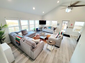 TV - 3BR Beachfront Retreat | Gulf Views, Wraparound Deck, Sleeps 12, Pet-Friendly, & More (Gilchrist)