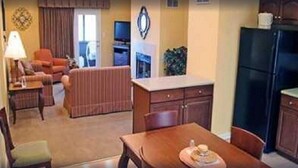 A compact living space with a dining area, kitchen, and a small seating area. - 4th of July Week 2024 Massanutten Resort, 2BDRM 2BA Sleeps 6 (Massanutten)