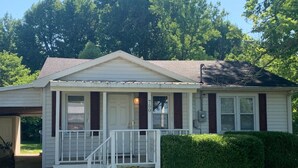 A single-story house with a front porch, a garage, and a mailbox. - Sweet Dreams in Sacramento (Sacramento)
