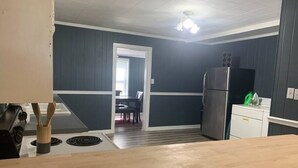 A kitchen with a wooden countertop, a stove, and a refrigerator. - Sweet Dreams in Sacramento (Sacramento)