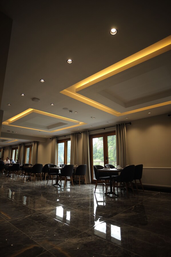 A conference room with a polished marble floor, recessed lighting, and large windows with curtains. - Pazarcik Mountain Hotel (Arakli)
