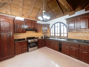Fridge, cookware/dishes/utensils, dining tables