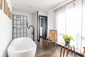 Bathtub, hair dryer, towels, soap