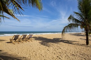 On the beach, sun-loungers, beach umbrellas, beach towels
