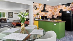 A modern kitchen with a green island, a dining area with a glass table, and a living room with a sofa and a coffee table. - Little Green House
Eclectic Olympic National Park Basecamp, Dogs allowed (Port Angeles)