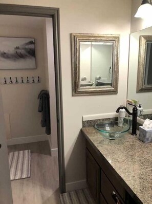 A bathroom with a glass sink, a mirror, and a towel rack. - 2 Bd 3 Ba, Luxury Ski-in Ski Out Condo - Sleeps 10 (Park City)