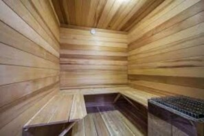 A sauna with wooden walls and benches.