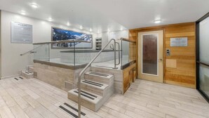A modern interior with a staircase, a sauna sign, and a framed picture on the wall. - Ski-In Out Mountain Luxury Studio Sleeps 6 (Park City)