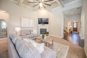 Open Living Room with Indoor Fireplace and Smart TV - **Modern & Cozy 3-Bedroom Home with Great Amenities** (Lewisville)