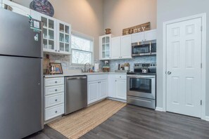 Fridge, coffee/tea maker, cookware/dishes/utensils