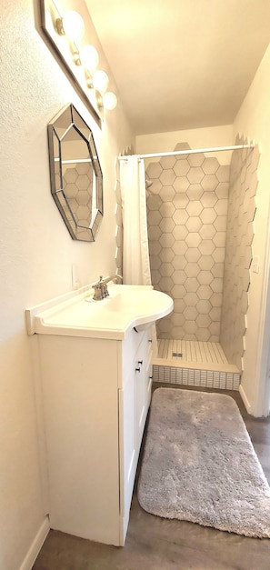 Combined shower/tub, hair dryer, towels, soap