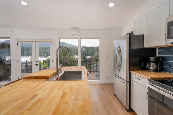 Fridge, cookware/dishes/utensils, dining tables