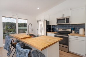 Fridge, cookware/dishes/utensils, dining tables