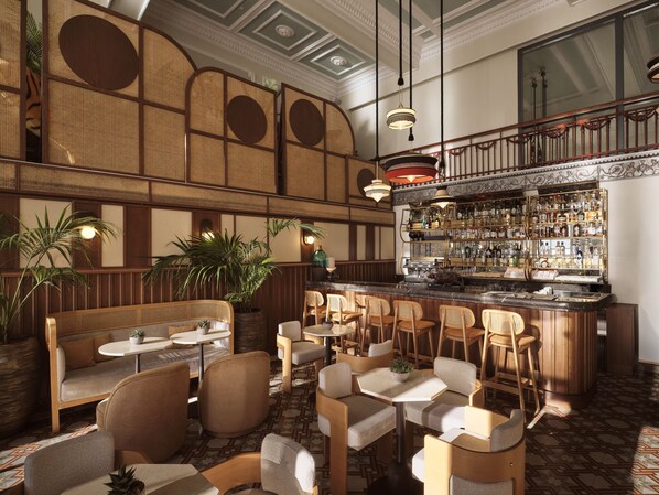 A bar area with seating, a bar counter, and a decorative ceiling.