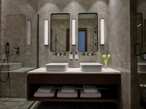 A modern bathroom with two sinks, a mirror, towel rack, and a shower. - ON Residence (Thessaloniki)