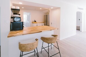 Enjoy cooking in this well-equipped kitchen with a microwave and ample counter space.