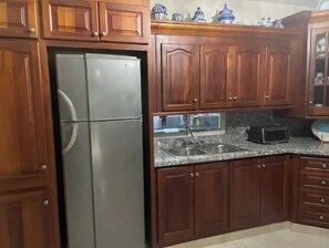 Fridge, microwave, stovetop, coffee/tea maker