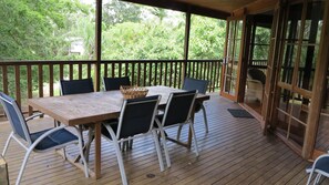 Outdoor dining - Kameruka - Modern, Queenslander style island home in leafy bushland with balcony (Arcadia)