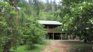 Property grounds - Kameruka - Modern, Queenslander style island home in leafy bushland with balcony (Arcadia)
