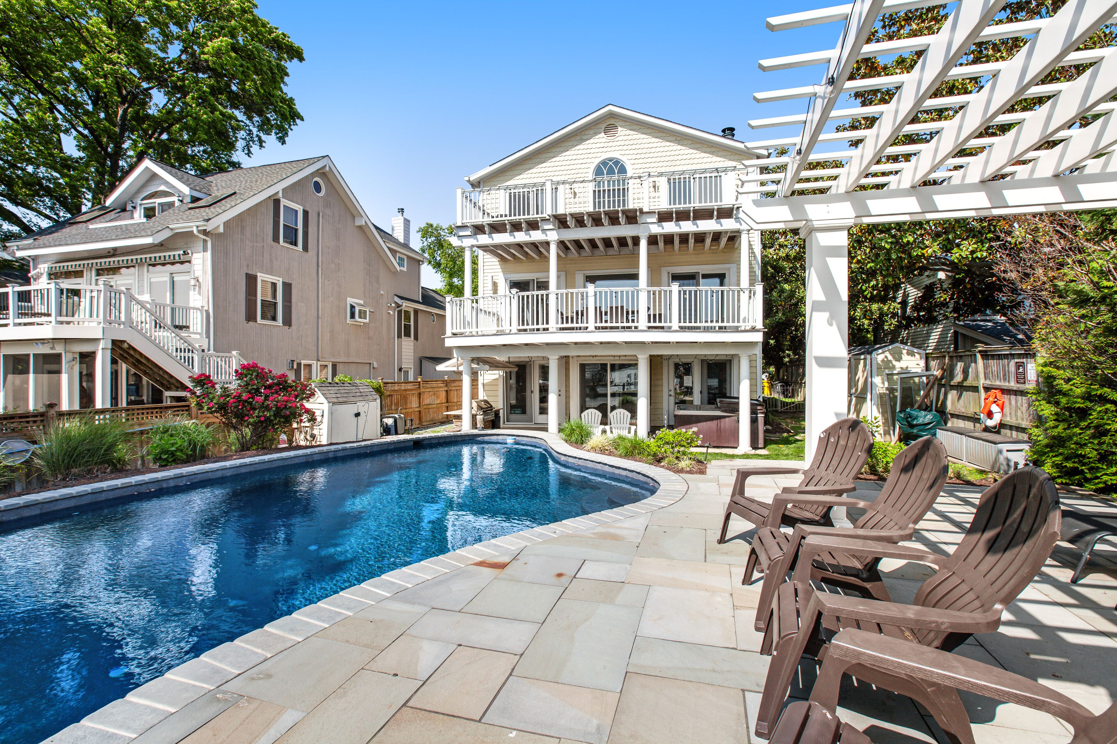 Renovated dog-friendly bayfront home with private hot tub & pool, grill, & dock
