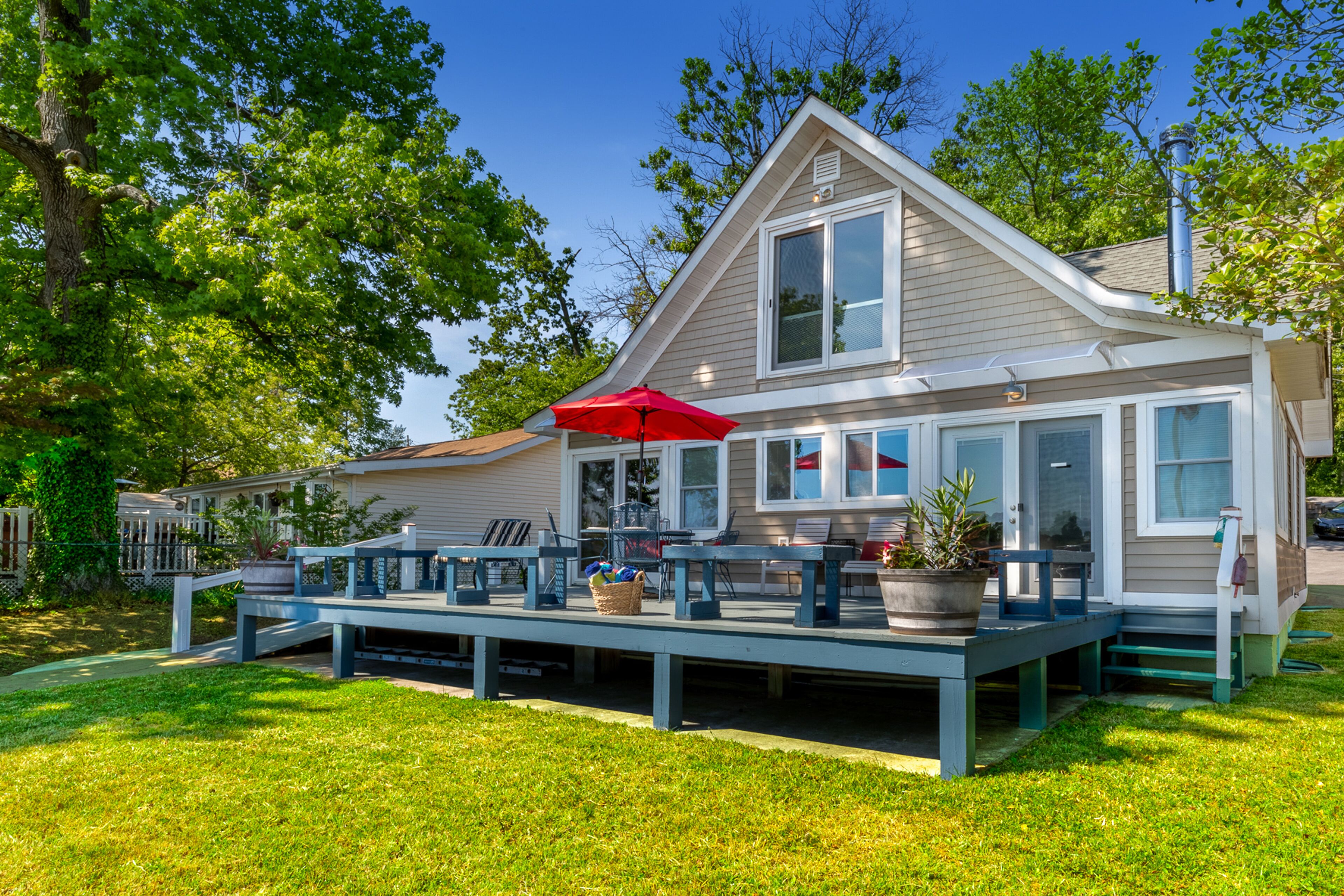 Waterfront home with spacious deck, dock, washer/dryer & central AC