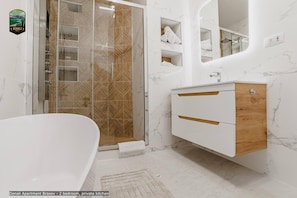 Bathtub, hair dryer, towels, soap
