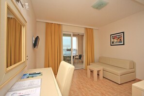 Basic Apartment | Living area | 32-inch flat-screen TV with cable channels, TV