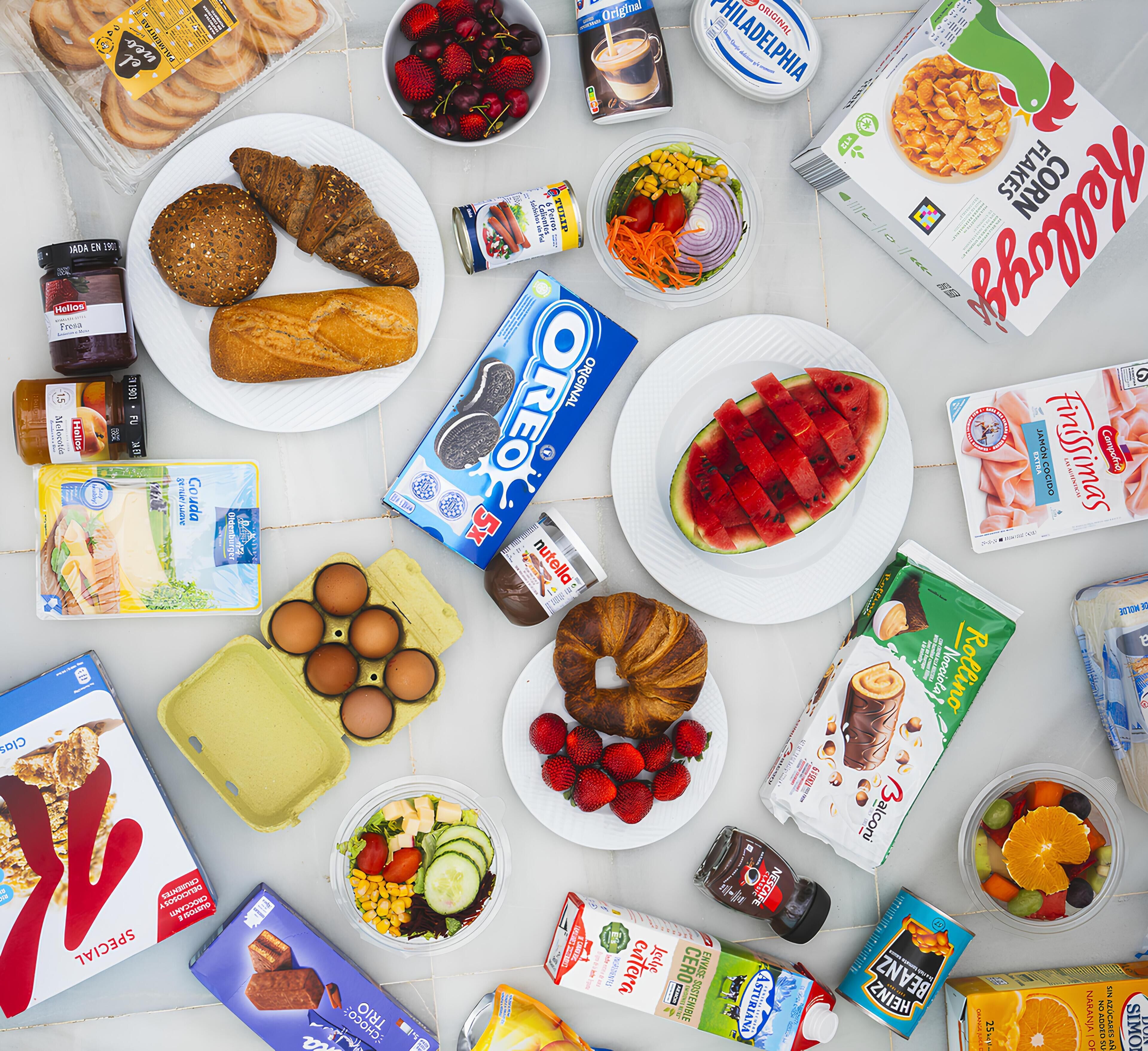 A variety of food items and products spread across a table.